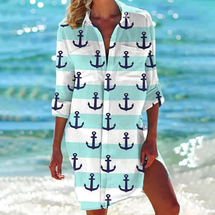 Women styling the Coralie shirt dress in mint green as a beach cover-up with flat sandals