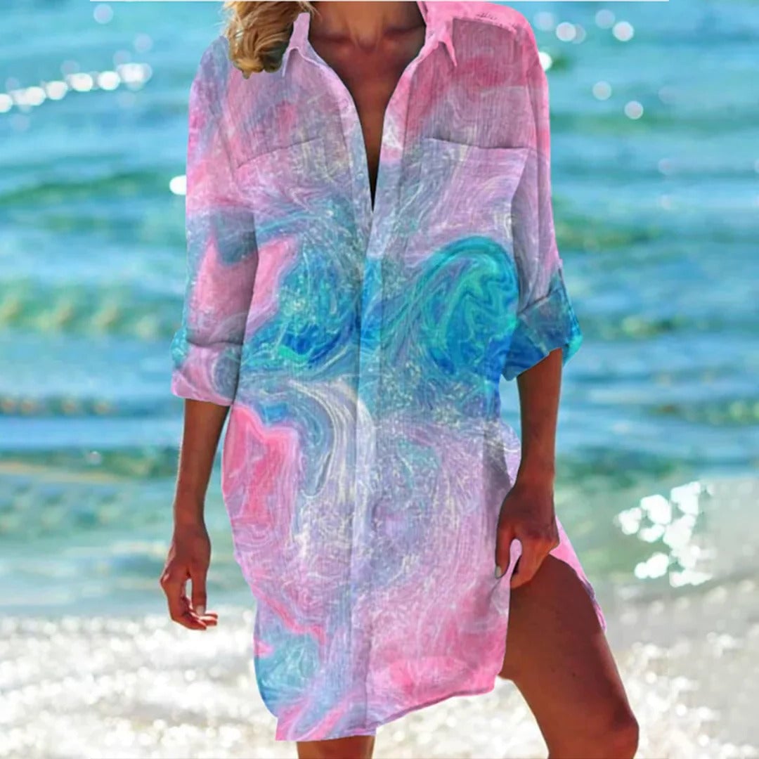 Detail shot of the 3/4 roll-tab sleeve and button placket on the Coralie tropical shirt dress
