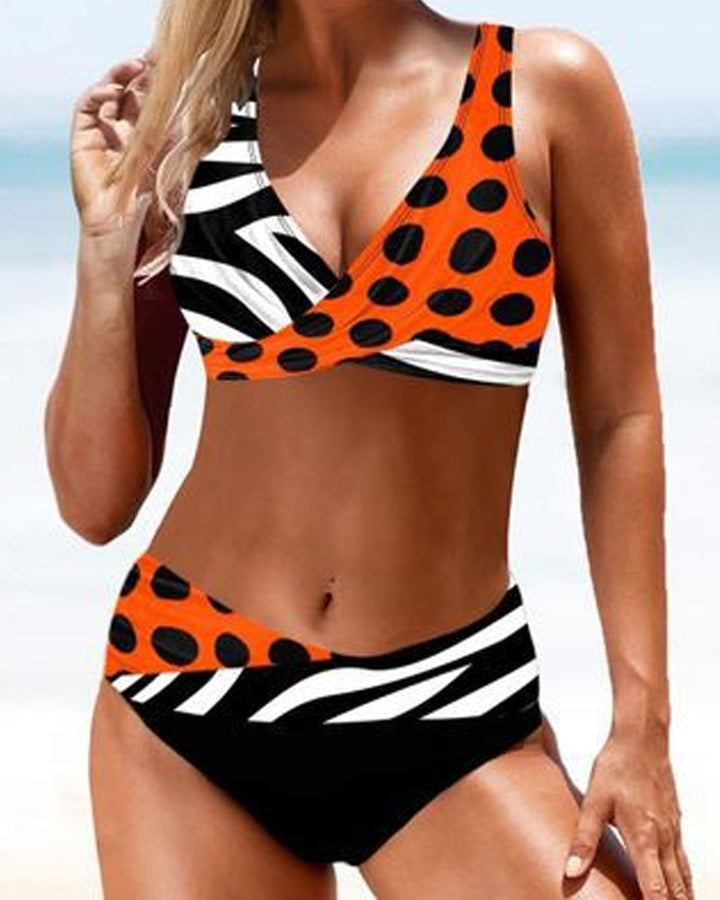 Close-up detail of the Cordelia bikini top in orange showing fabric texture