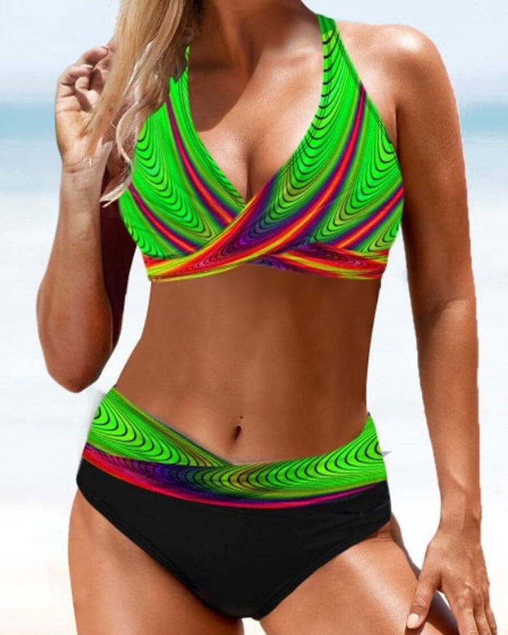 Model wearing the Cordelia multicolor bikini set at a tropical beach location