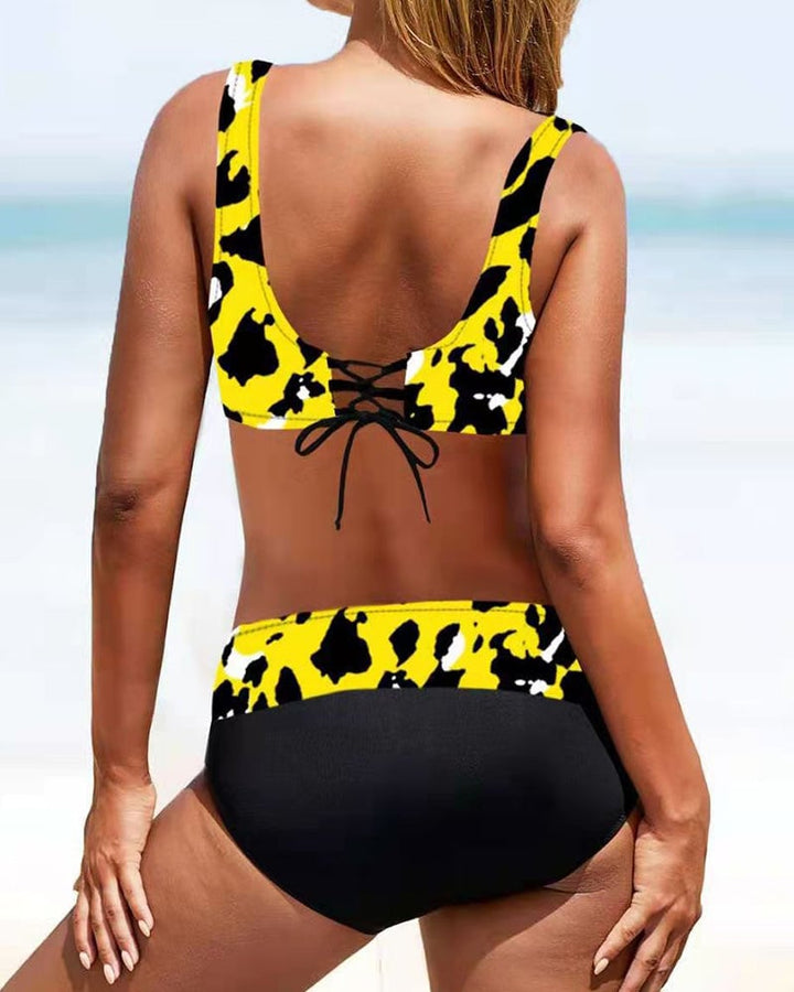 Lifestyle shot of the Cordelia women's bikini set styled with a sarong and sunglasses