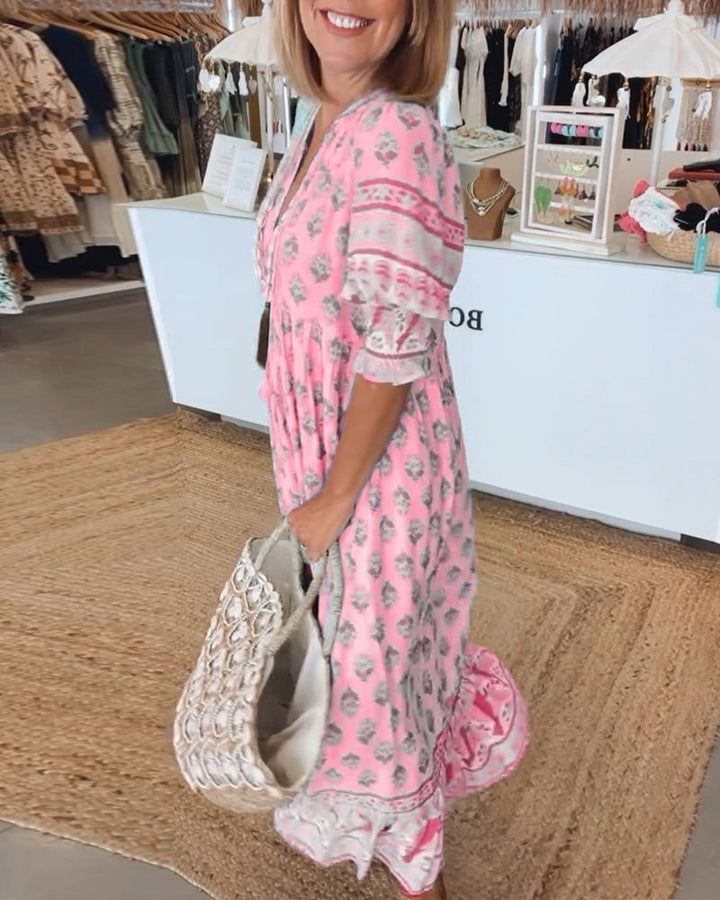 Model wearing Cordelia floral dress in green styled with sandals