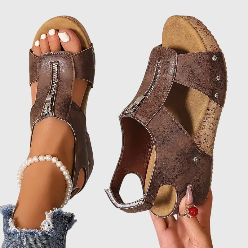 Top-down view of Cordula orthopedic sandal in black highlighting adjustable strap design