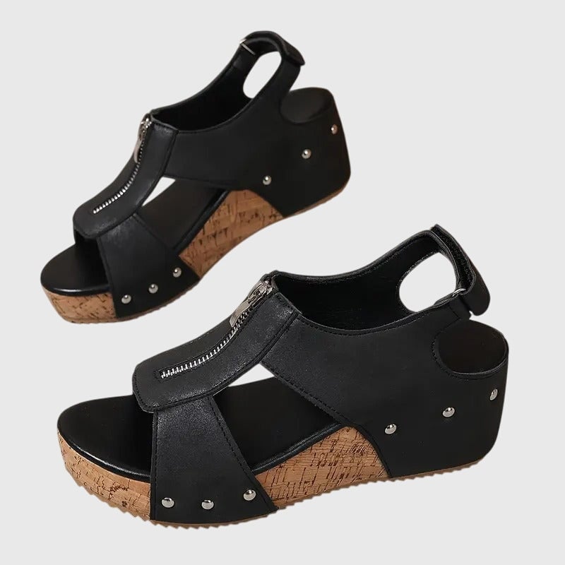 Side profile of Cordula sandal in beige showing cushioned footbed and zipper accent