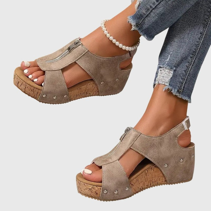 Angled view of Cordula orthopedic zipper sandal in brown showing full silhouette