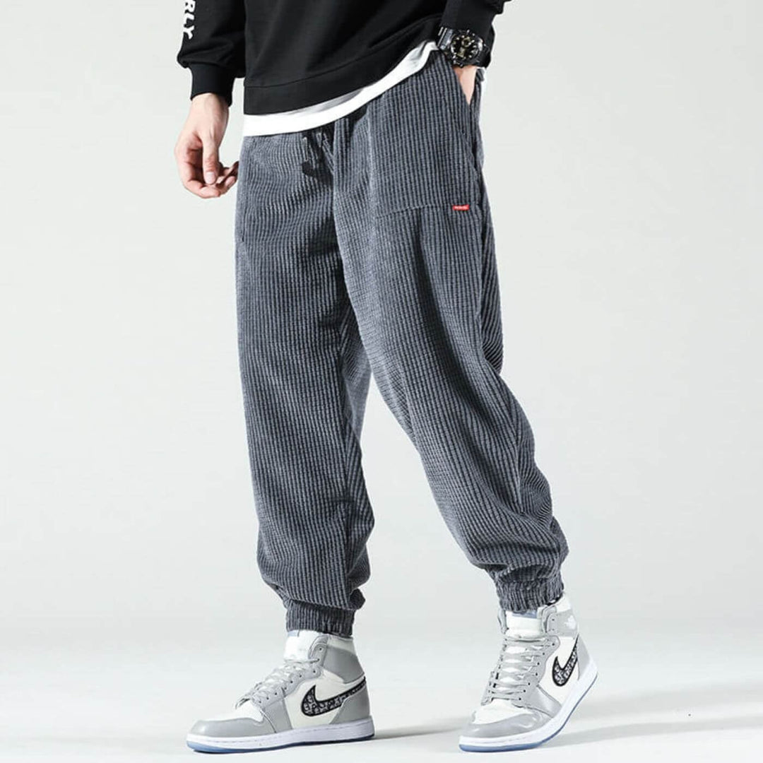 Close-up collage showing the soft corduroy texture and stretch of the joggers in multiple colors