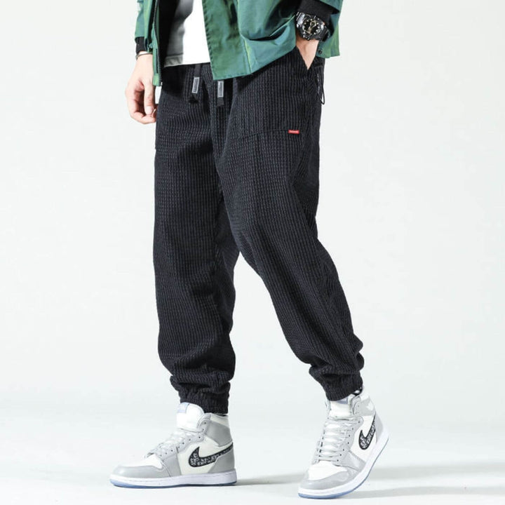 Front view of classic corduroy joggers styled with a casual top and sneakers