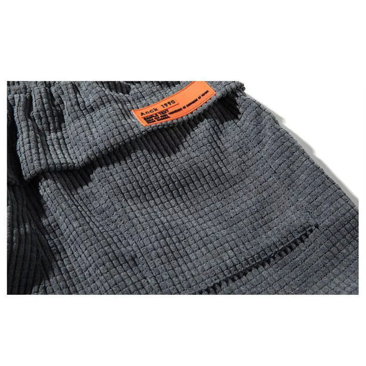 Side view of grey corduroy joggers highlighting the tailored silhouette and comfortable fit