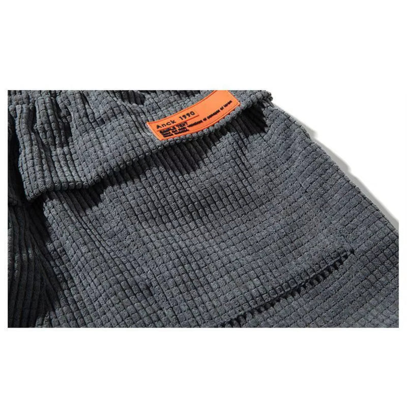 Side view of grey corduroy joggers highlighting the tailored silhouette and comfortable fit