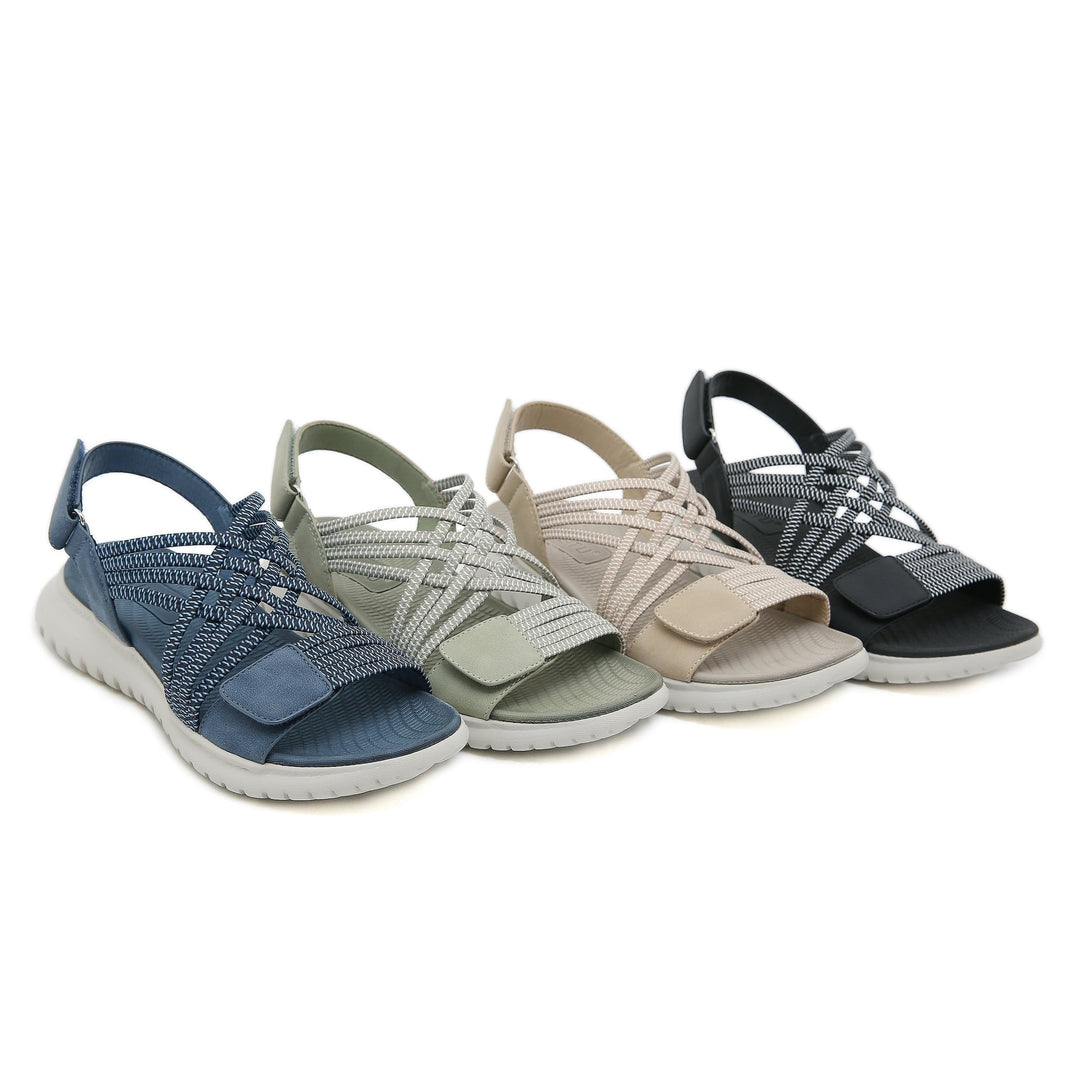 Close-up of Cosette sandal adjustable strap hardware in green