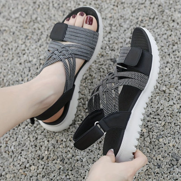 Cosette orthopedic sandals in blue worn on feet, lifestyle shot