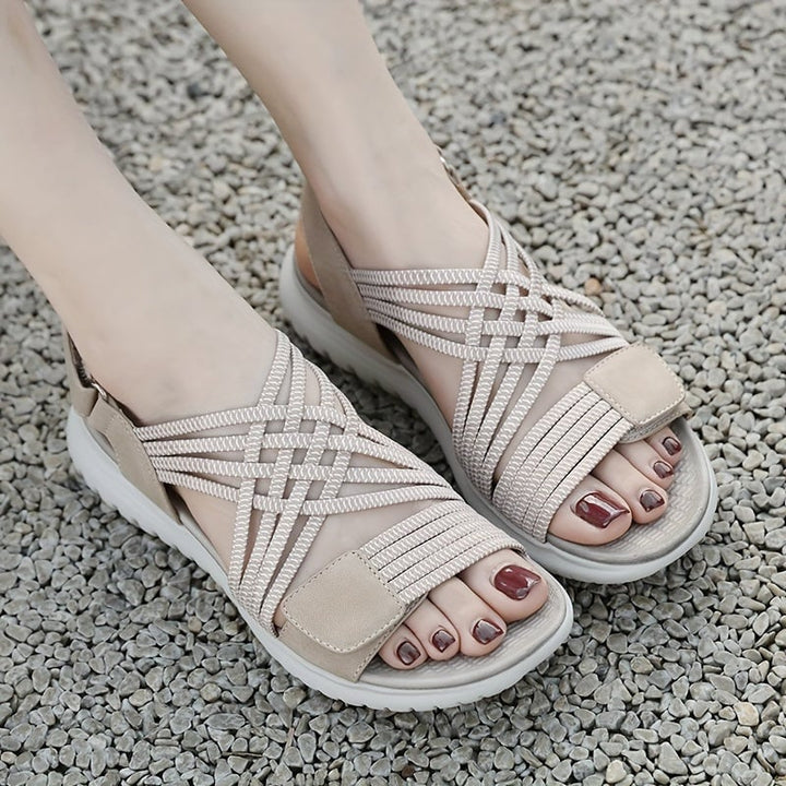 Cosette sandals in beige worn with casual linen pants, lifestyle shot