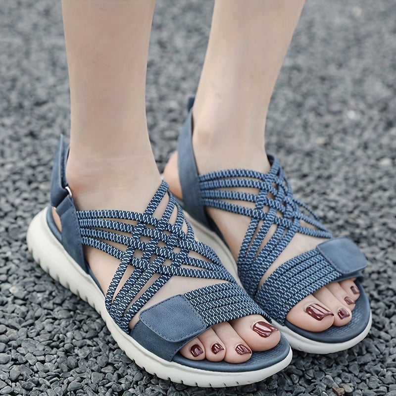 Cosette orthopedic sandals in black shown on feet from side angle
