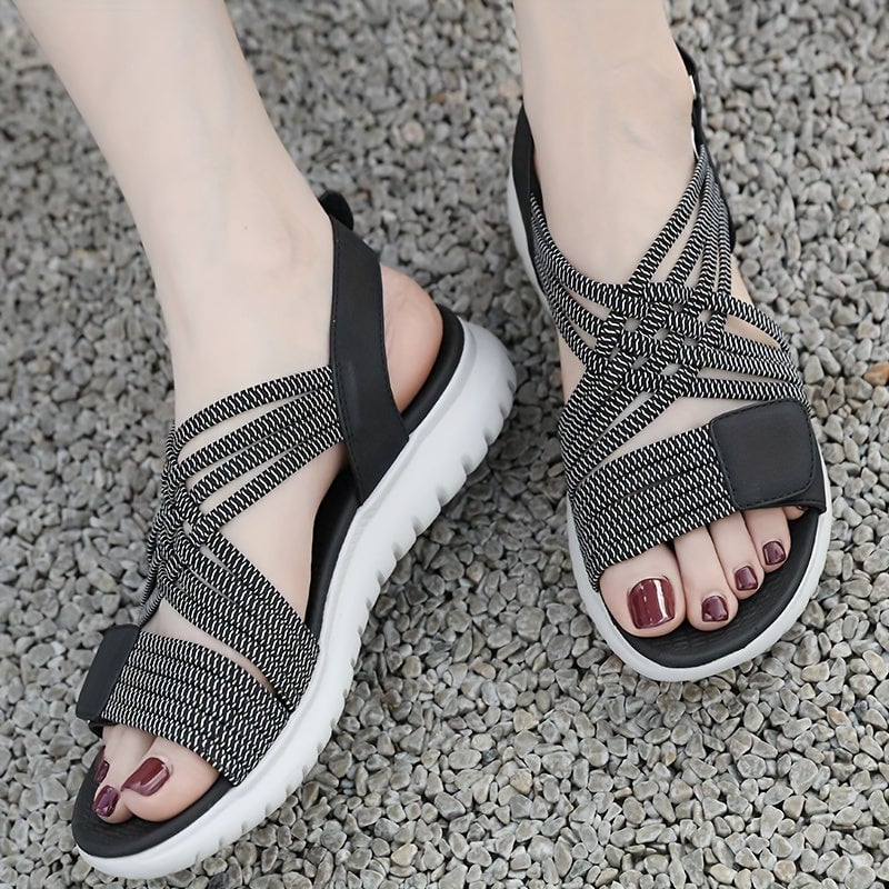 Cosette sandals in green shown from rear to highlight ankle strap
