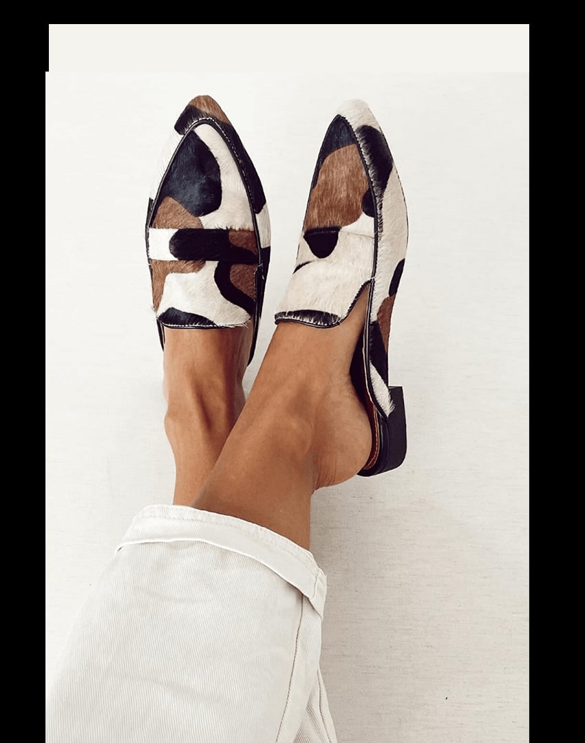 Courtney chic black and white pattern loafers shown from a front angle, featuring a sleek silhouette and bold patterned upper