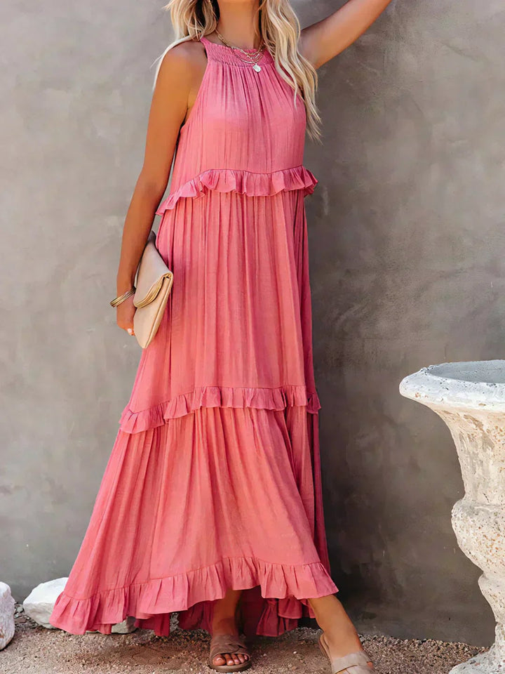 Front view of the Courtney sleeveless ruffle dress in pink, highlighting the flattering silhouette and ruffle accents