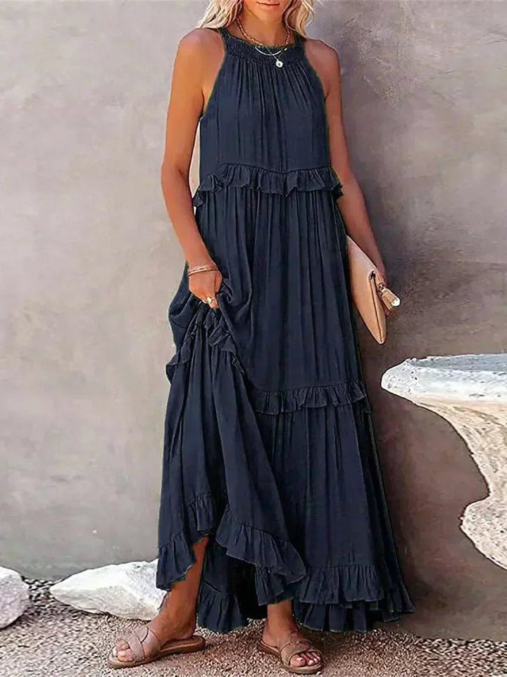 Close-up of ruffle detailing on the Courtney sleeveless dress in dark blue