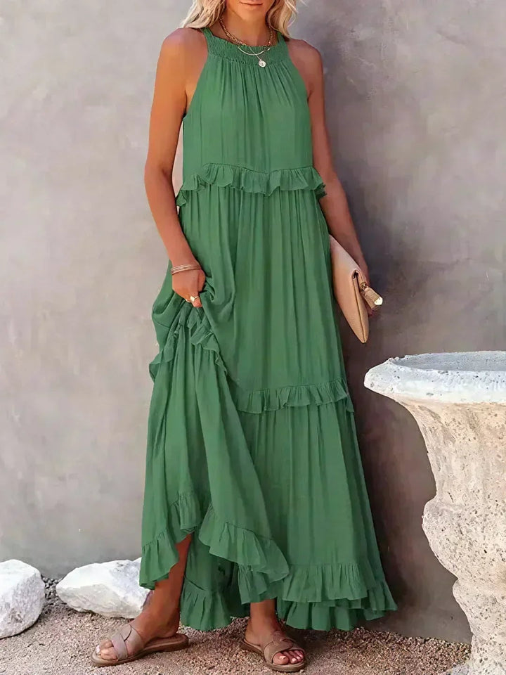Full-length view of the Courtney ruffle dress in green, showcasing the easy flowing fit