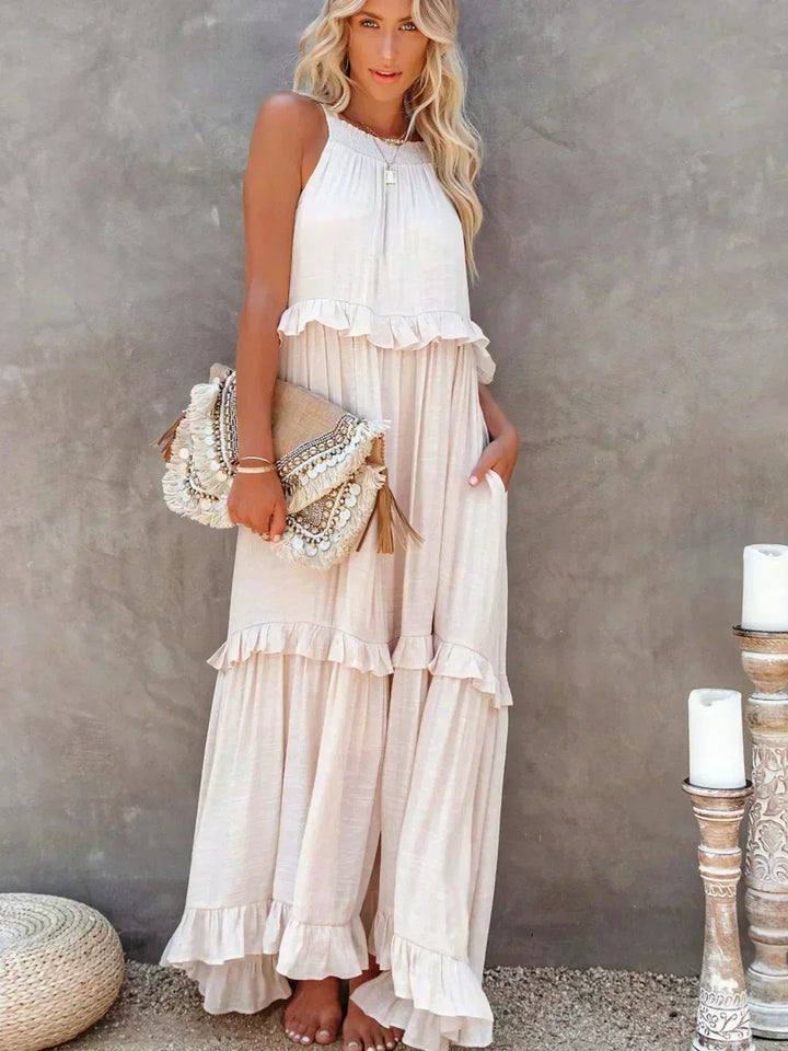 Back view of the Courtney sleeveless ruffle dress in beige, highlighting the clean neckline