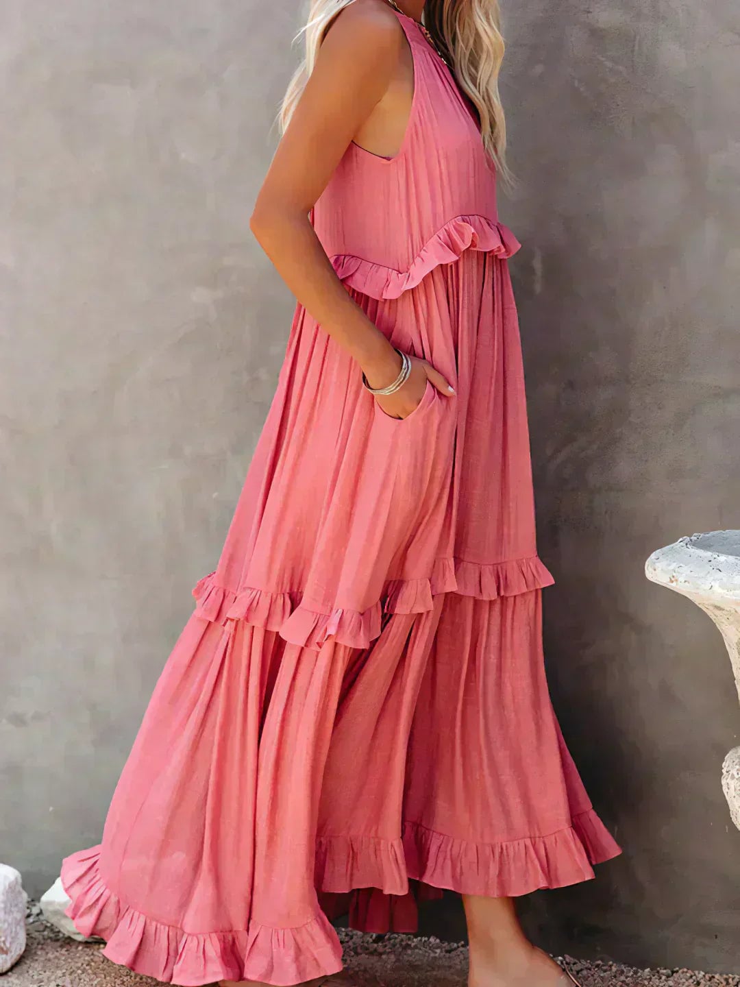 Woman in the Courtney ruffle dress in purple, smiling and twirling to show movement