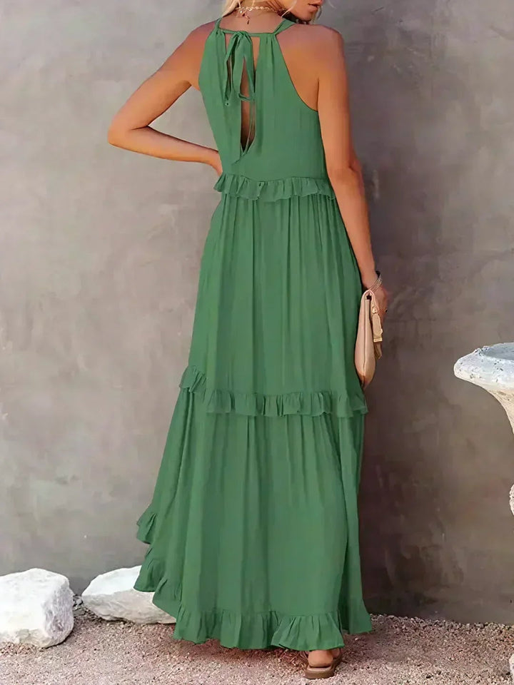 Overhead flat-lay of the Courtney ruffle dress in green showing fabric texture