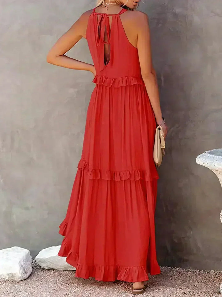 Courtney sleeveless dress in yellow, detail of waist area and flowing skirt