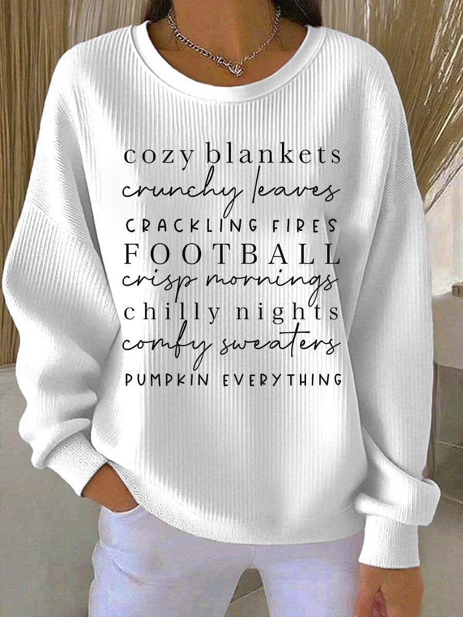 Front view of the Cozy Season sweatshirt in white showing the relaxed silhouette and seasonal design detail