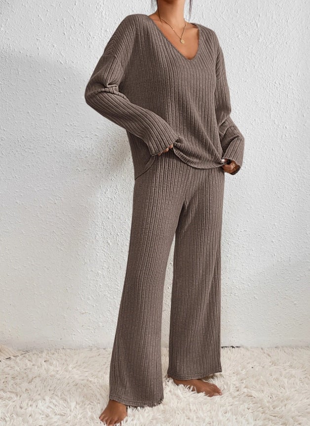 Model wearing ribbed knit two-piece set in black, styled casually