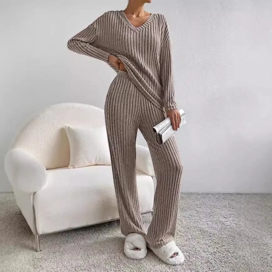 Side view of ribbed knit trouser and sweater set in olive green showing silhouette