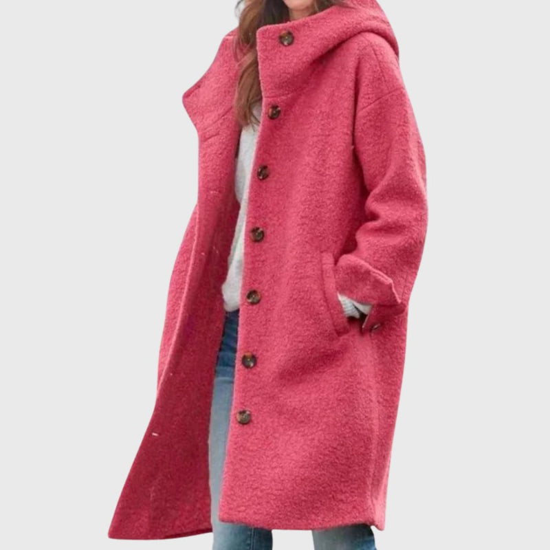 Woman wearing a warm classic coat in a flattering tailored silhouette, front view