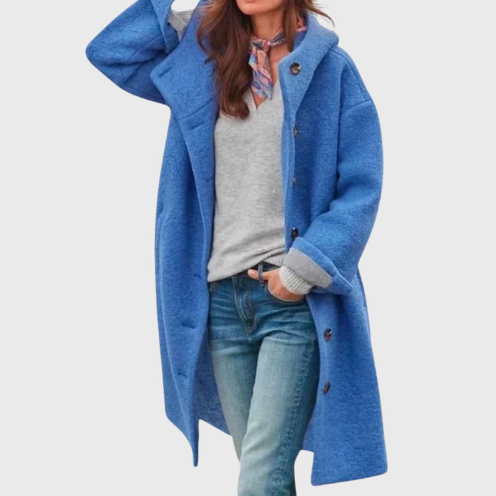 Warm classic coat laid flat showing clean lines, pockets, and polished design details