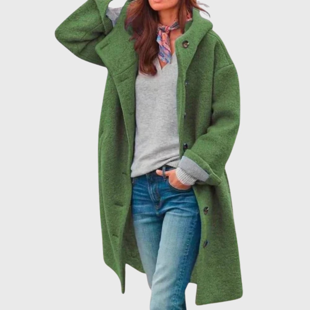 Model wearing warm classic coat in a neutral setting, showcasing its elegant everyday versatility