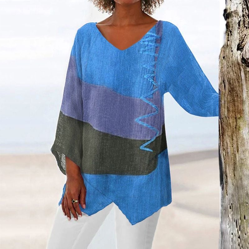 Yellow V-neck long shirt with bold brushstroke print worn casually