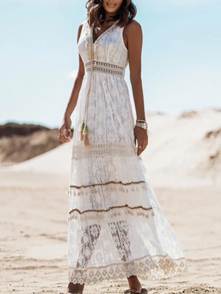 Side profile of a woman wearing the bohemian style dress in white, highlighting the flattering cinched waist and airy fabric
