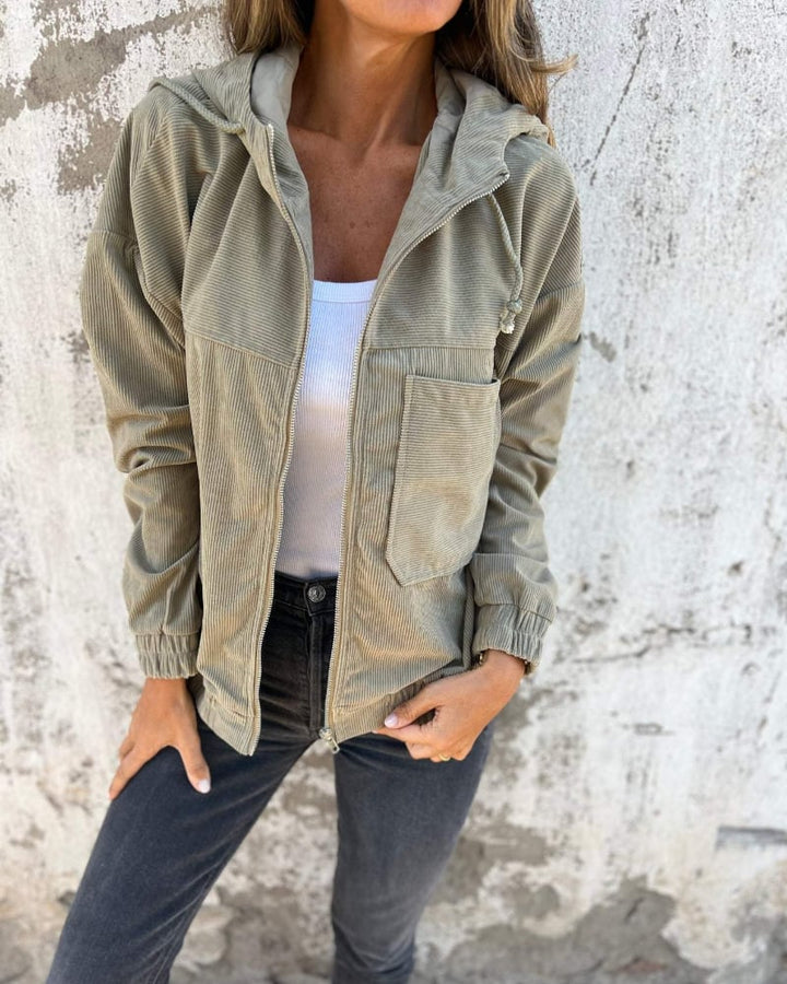Side view of the Cynthia hooded jacket highlighting the relaxed fit and sleeve length