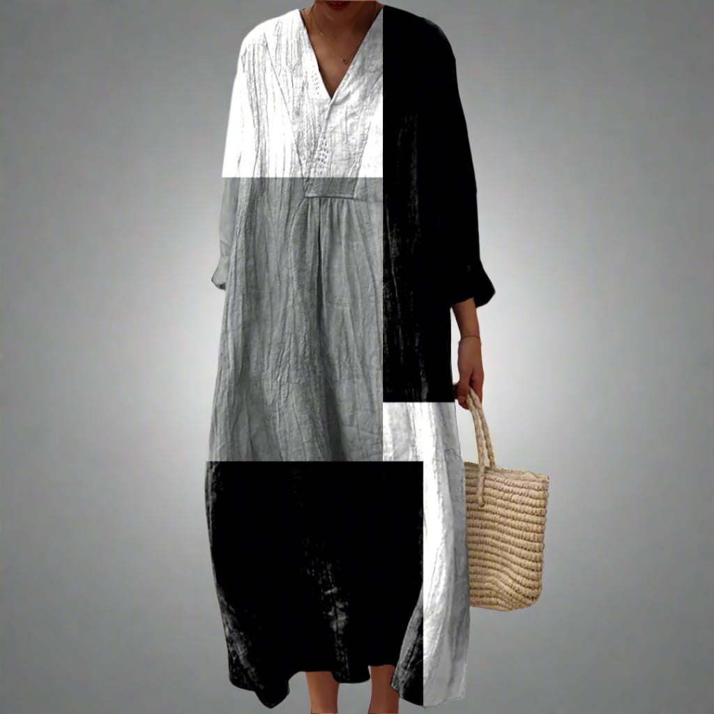 Model wearing the Dahlia Elegant Geometric Dress featuring a bold dream-inspired geometric print and flowing silhouette