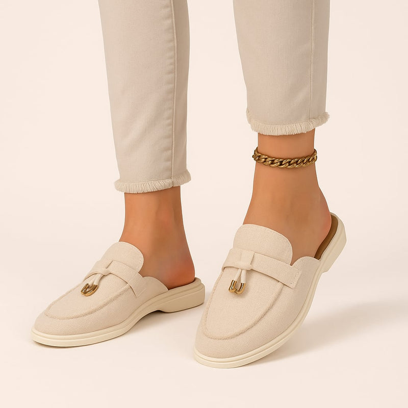 Dahlia beige closed-toe buckle sandals shown from a front three-quarter angle on a clean white background