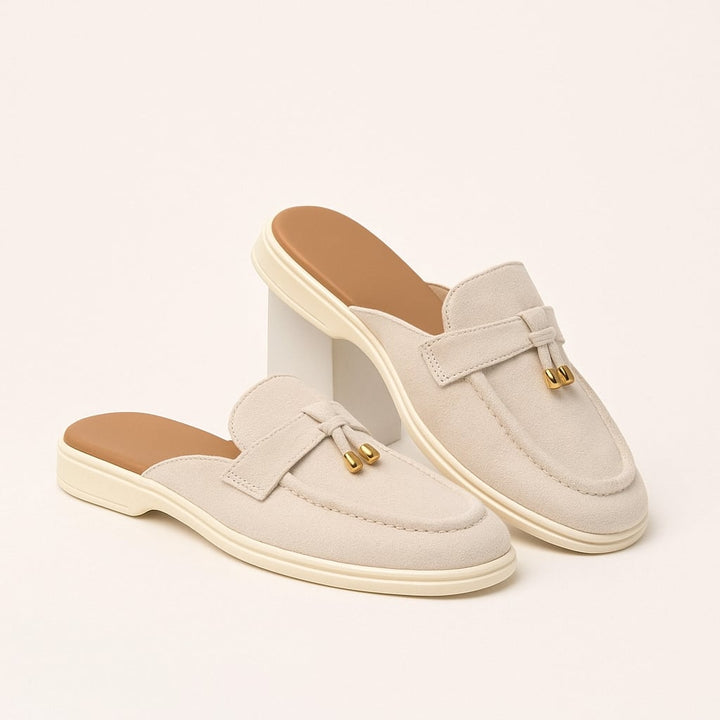 Side profile view of the Dahlia beige buckle sandals highlighting the cushioned footbed and adjustable strap detail