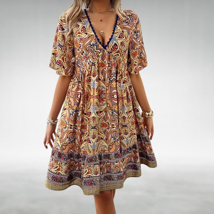Side profile of the Dahlia draped dress showing the graceful silhouette and comfortable, non-restrictive fit