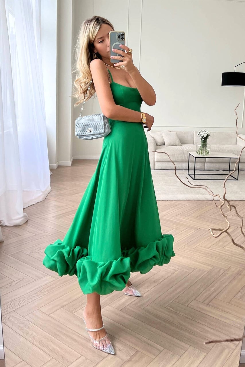 Side profile of the Dahlia flowing dress highlighting the fluid movement