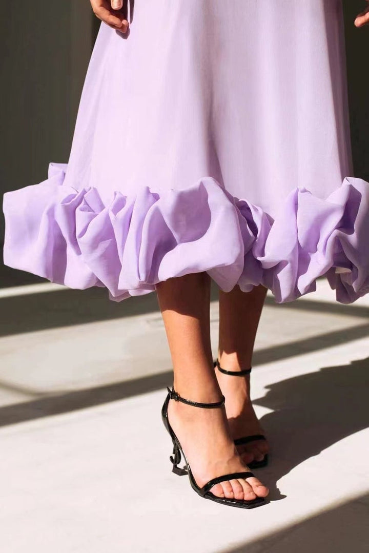 Dahlia dress in purple showcasing the flattering silhouette from the back