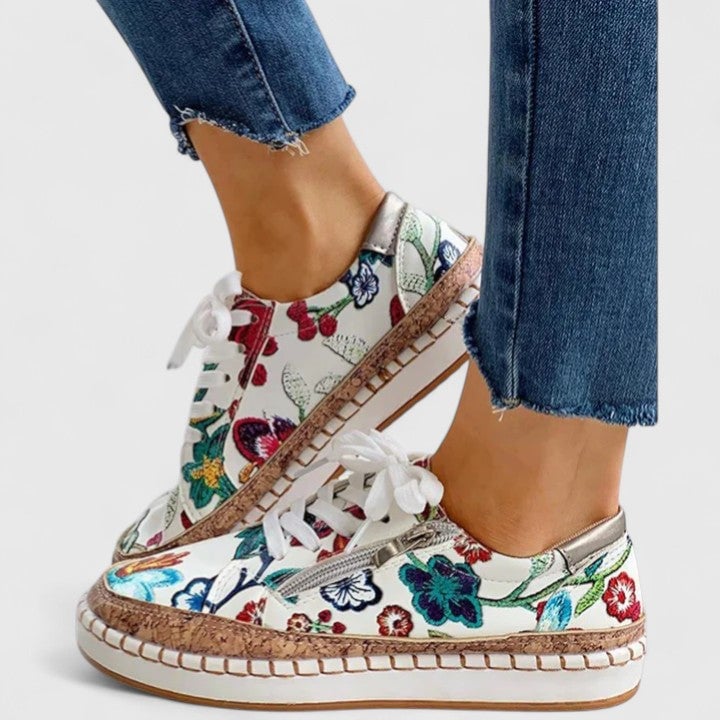 Dahlia floral print platform lace-up sneaker in Bella Flora colorway, front three-quarter view showing embroidered upper and cork-effect sole