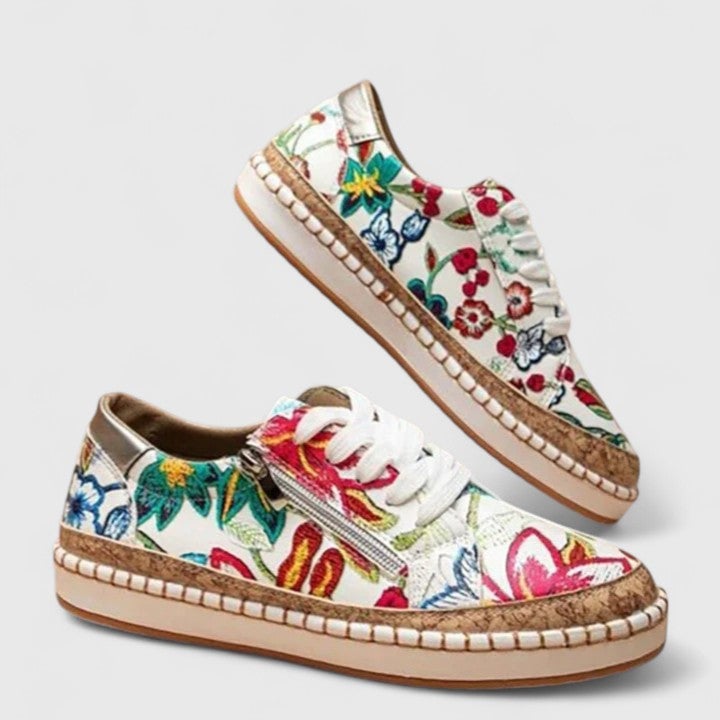 Dahlia sneaker in Blue Flora colorway styled with a flowy sundress on an outdoor setting