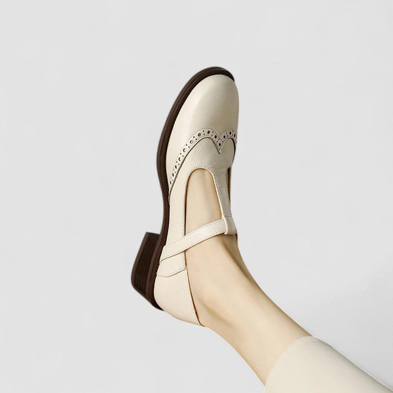 Lifestyle shot of the Daisy Mary Jane shoes in black styled with a flowy midi dress