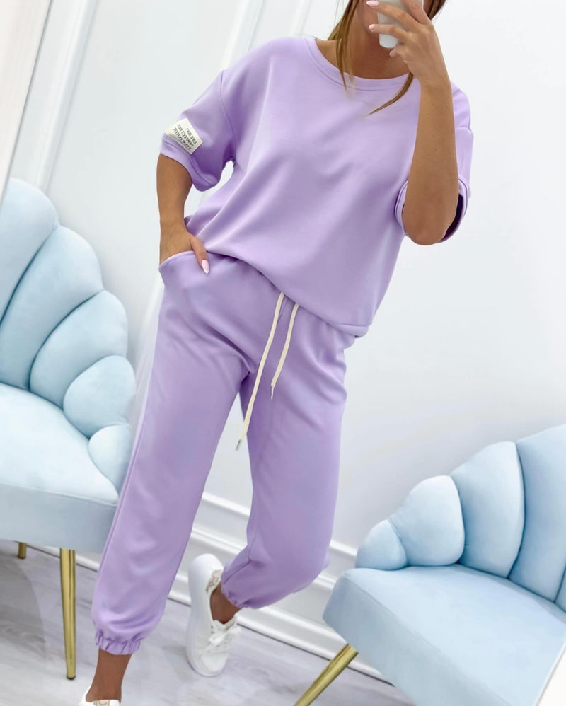 Side view of purple lightweight short sleeve set highlighting easy movement fit