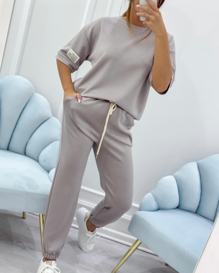 Gray short sleeve matching set showing relaxed top and wide-leg trouser pairing