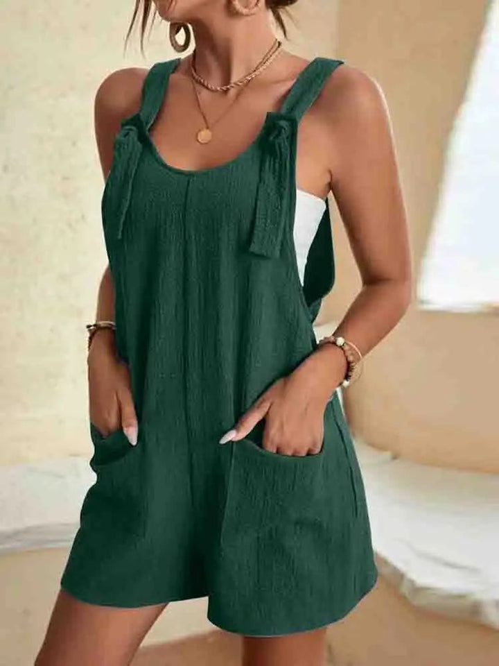 Back view of the Daisy linen romper in brown showing the relaxed fit and lightweight linen fabric