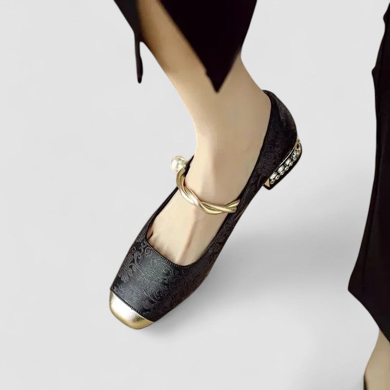 Top-down view of black orthopedic mary jane shoes showing rounded toe detail