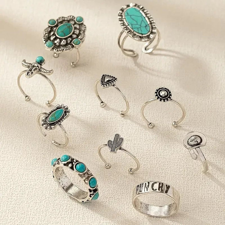 Close-up of turquoise western-style rings stacked on a model's hand