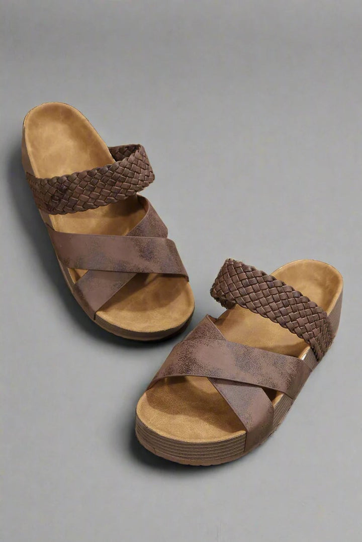 Dana sandals in black laid flat showing full silhouette and breathable lightweight upper